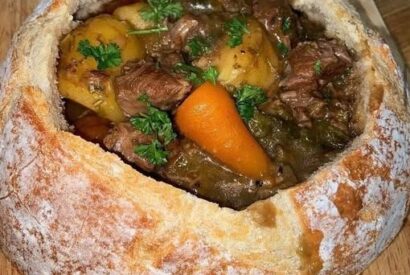Thumbnail for Beef Stew Served in a Bread Bowl (Hearty & Comforting)